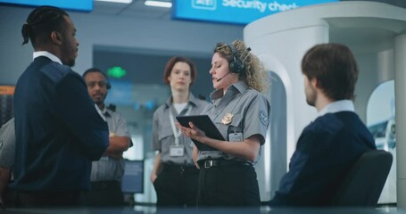 Airport Security System: Female Security Officer in Headset with Tablet Computer Instructs Airport Staff at Checkpoint About Passengers Scanning Process, TSA Screening Procedures for Boarding Flight. - Powered by Adobe
