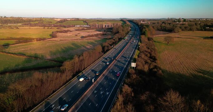 M4 motorway from Bristol to London. Flight under the motorway during the sunset.