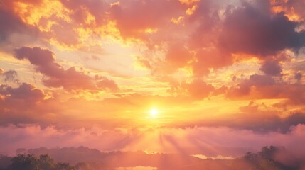 Fototapeta premium A vibrant sunset over a landscape shrouded in mist. Sunrise rays pierce through clouds