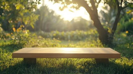 Fototapeta premium A wooden table sits outside amidst green plants and sunshine