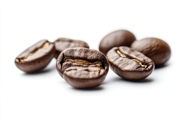 Obraz premium Fresh roasted coffee beans scattered on a clean surface, showcasing their rich color and texture