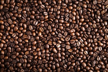 Fototapeta premium Freshly roasted coffee beans create a rich texture and aroma in a close-up view showcasing their glossy surface