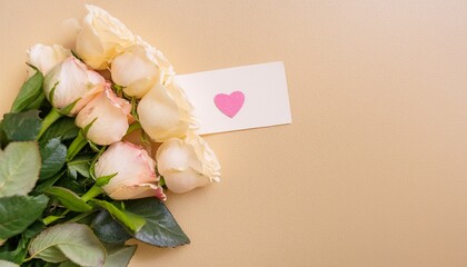 white bouquet of roses with love letter