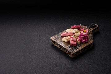 Multicolored handmade chocolate bars pink, white, brown colors