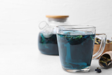 Delicious butterfly pea flower tea on white table