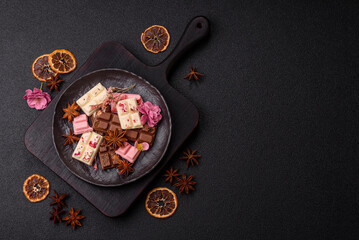 Multicolored handmade chocolate bars pink, white, brown colors