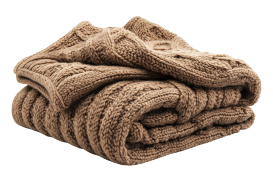 Cozy knitted blanket in warm brown hues stacked neatly on a soft surface, enhancing autumn vibes in a living room