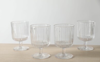 Many empty clean glasses on wooden table