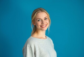 Fototapeta premium Portrait of a Nordic blond female with a warm smile