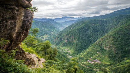 Naklejka premium Mountain valley vista from clifftop path