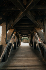 Historic wooden bridge with a perspective view. Architectural detail, European architecture. Traditional building, outdoor scene, historic town.