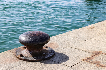 Iron mooring for large tonnage ships at the dock of a port.