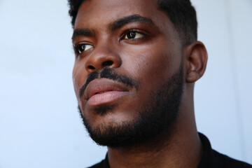 Obraz premium Close-up African American man over isolated white background looking away. Isolated.