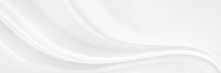 White gray satin texture that is white silver fabric silk background with beautiful soft blur...