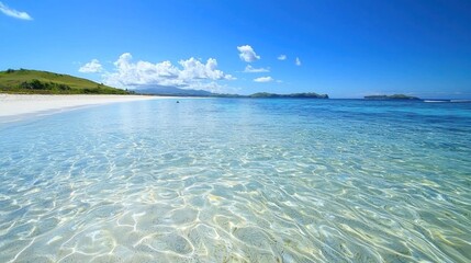 Tropical beach, calm turquoise water, sunny day, hills in background. Use Travel postcard