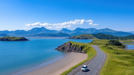 Armed vehicle travels along a road beside a tranquil body of water.