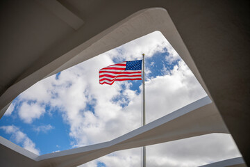 The flag flies proudly above the USS Arizona