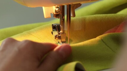 The process of sewing fabric on a sewing machine, The sewing machine needle in motion