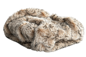 Luxurious spotted fur throw draped elegantly on a surface, showcasing its soft texture and natural patterns