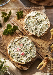 Nettle butter - homemade bread spread made of wild edible plants harvested in spring, with lungwort flowers