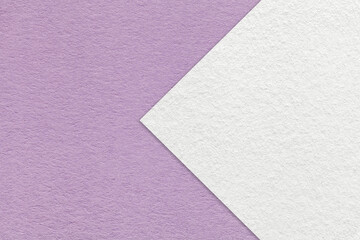 Fototapeta premium Texture light violet paper background, half two colors with white arrow, macro. Structure craft lilac cardboard.