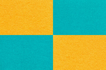 Texture craft yellow and cerulean paper background with cells pattern, macro. Structure vintage turquoise cardboard.