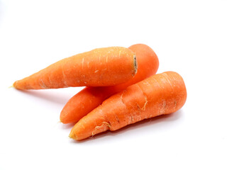 A fresh, vibrant carrots rests against a clean white background, showcasing its bright orange color and smooth, firm texture