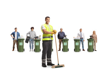 Young male cleaner in a uniform holding a broom and people recycling materials
