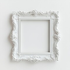 White, ornate picture frame with a decorative border.