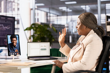 Interviewer holding teleconference meeting with job candidate, greeting him and asking questions...