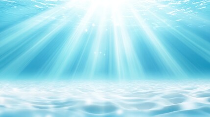 Sunlight filters through the ocean, illuminating sandy textures beneath the water's surface.