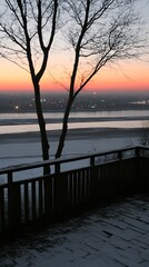 Obraz premium Winter dawn deck view, bare trees silhouettes and fading sky colors