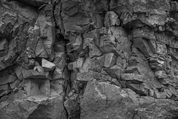 Texture, background layers and cracks in sedimentary rock on cliff face. Limestone.