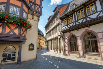 Wernigerode, Germany – August 29, 2024: Next to the famous Town Hall in the famous medieval city of Wernigerode there is one of its many alleys. The old town of Wernigerode is popular among tourists.
