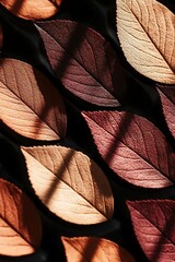 Subtle autumn palette background with fallen leaves in dark shades
