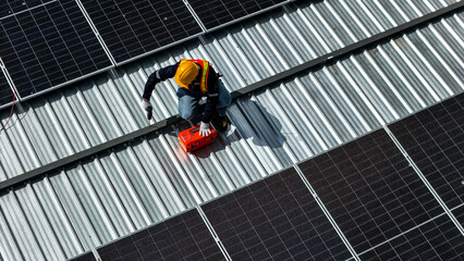 Workers installing and inspecting solar panels on a rooftop in a sunny environment, highlighting...