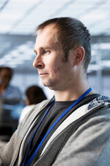 Software developer in server hub implementing power management solutions to reduce energy consumption. Man integrating new technologies and systems in data center establishment