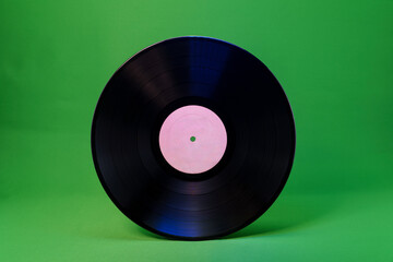 Blank vinyl record with white label on green background