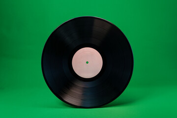 Obraz premium Blank vinyl record with white label on green background