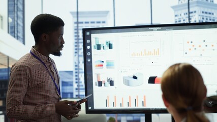 Team of company analysts reviews feedback on sales and orders to work on improvements, developing...