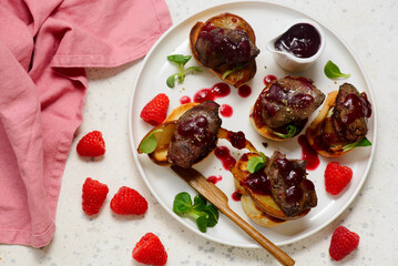 Crostini with chicken liver, caramelized pear and raspberry sauce.top veiw