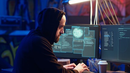 Hooded spy managing to steal military secrets on SSD, proudly looking at it. Hacker group hired by...