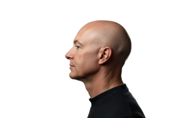 Profile view of a bald man showcasing his features against a plain background