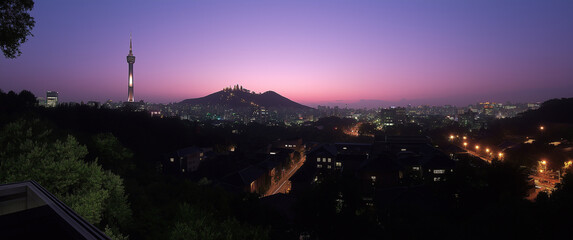 a panoramic view of seoul's skyline at night,