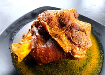 Close up steamed pork leg in plate, in door Chiangmai Thailand.