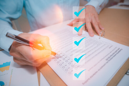 Businessman pressing to tick mark in checkbox for quality document control checklist and business approve project concept. Successful completion of business tasks. management goal strategy