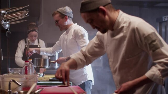 Team working together in kitchen of restaurant