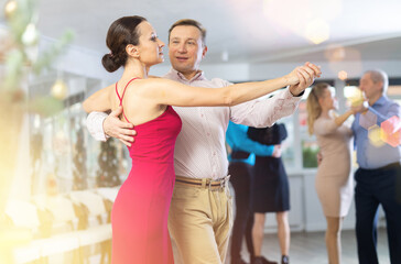 Adult couple dancing and practicing in dance class