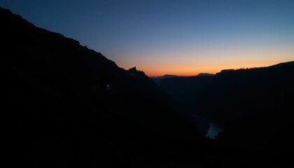 Fototapeta premium Serene Twilight Over Mountains and River at Dusk in Nature Landscape