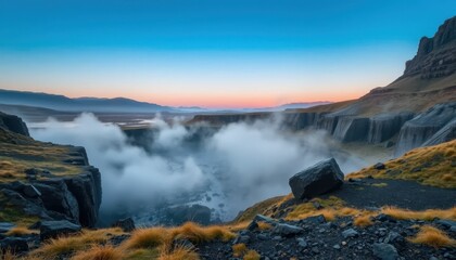 Fototapeta premium Serene River Valley with Misty Fog and Dramatic Mountain Landscape
